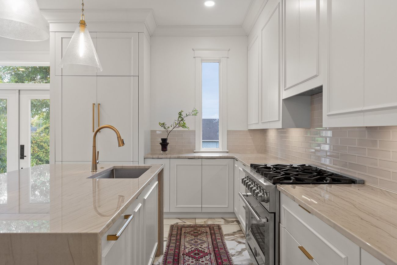 Custom kitchen island with brushed brass hardware
