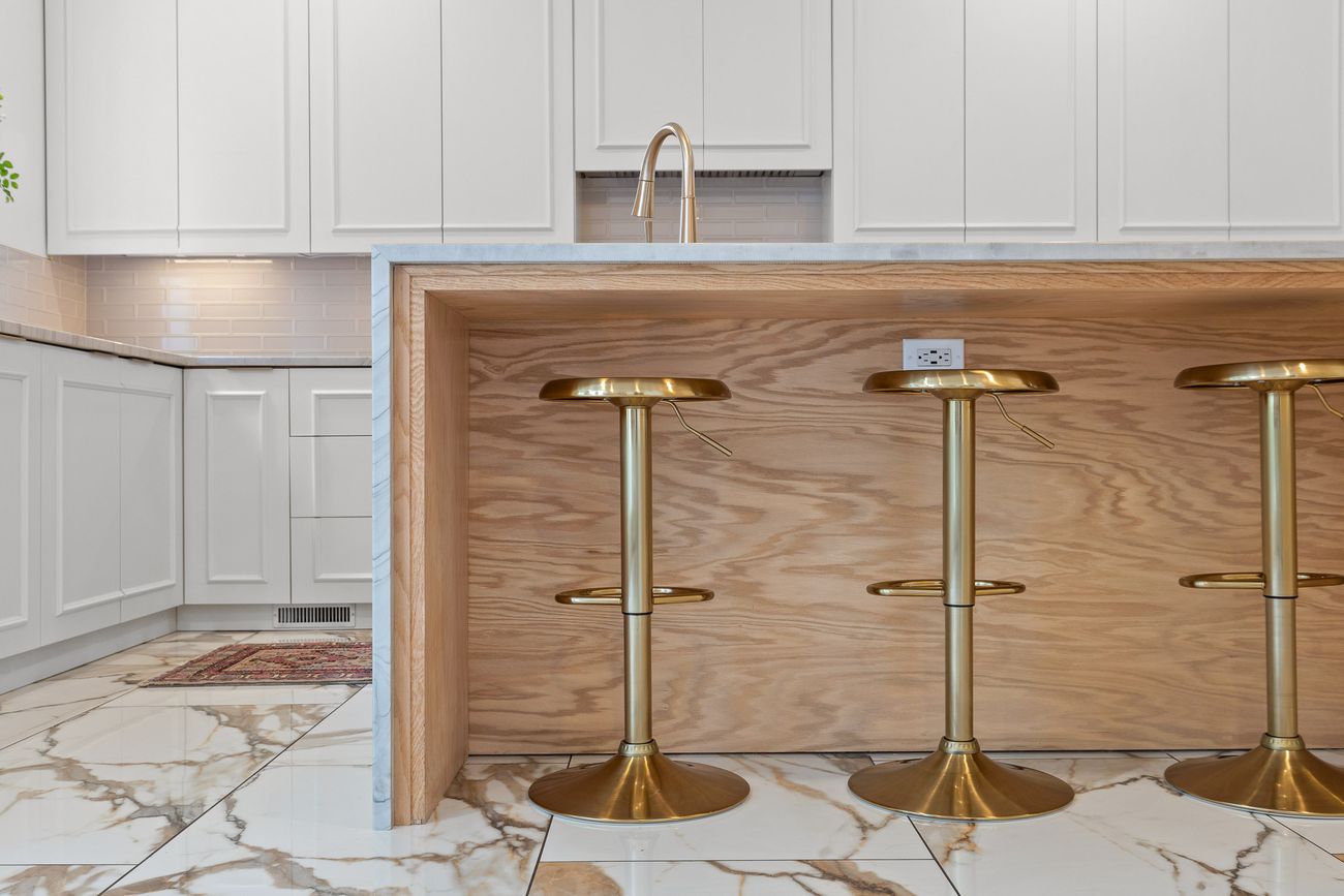 Custom kitchen island with brushed brass hardware