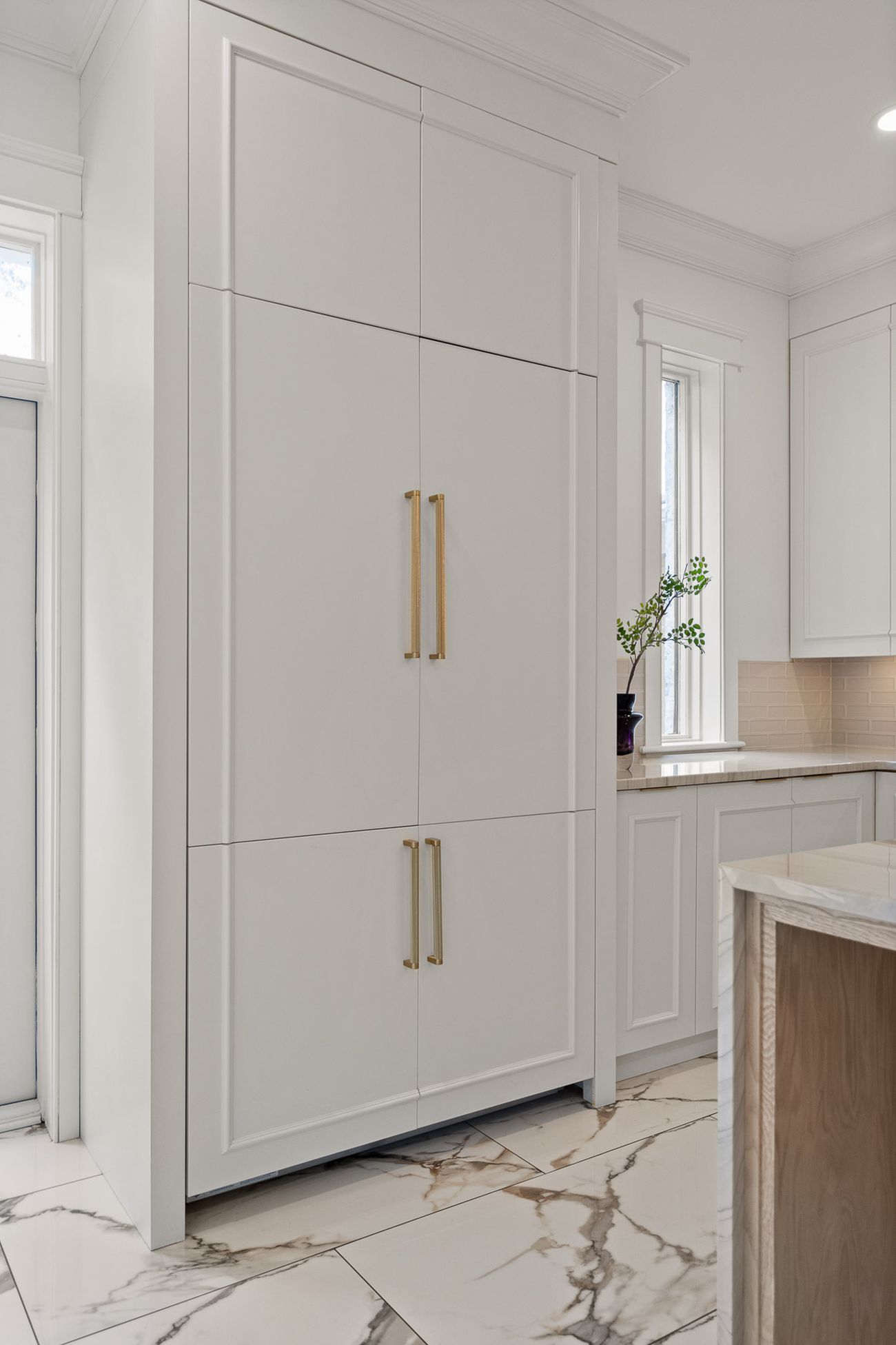 Handcrafted cabinetry and marble surfaces