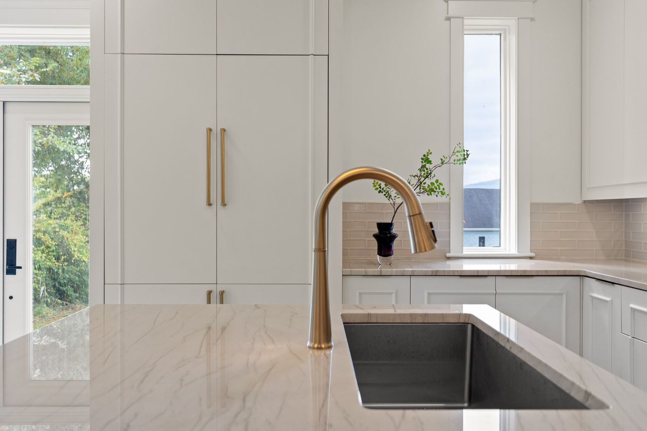 Bespoke kitchen joinery with brass detailing