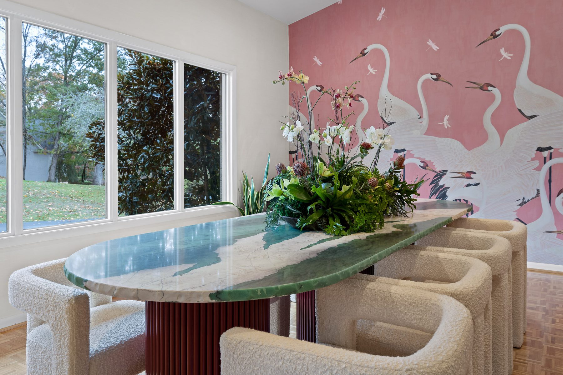 River-view sitting area with a live-edge glass-top bar and curved seating